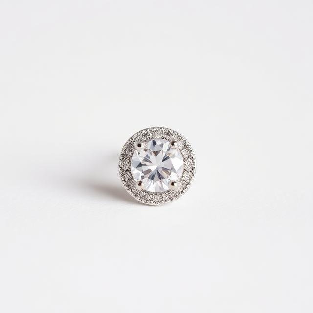 Halo diamond stud earring with a pavé diamond surround in white gold